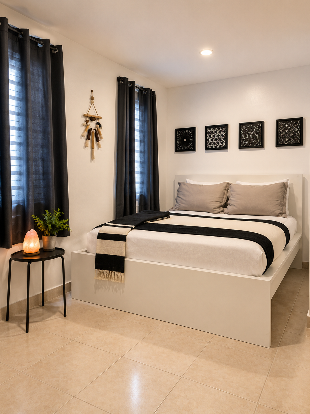 Alternate view of the Rota bedroom with curtained windows, bedside table and salt lamp