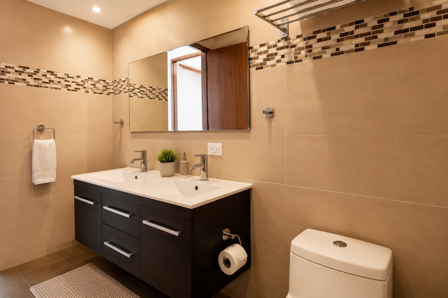 Modern bathroom with a double vanity, wide mirror and mosaic tile detail