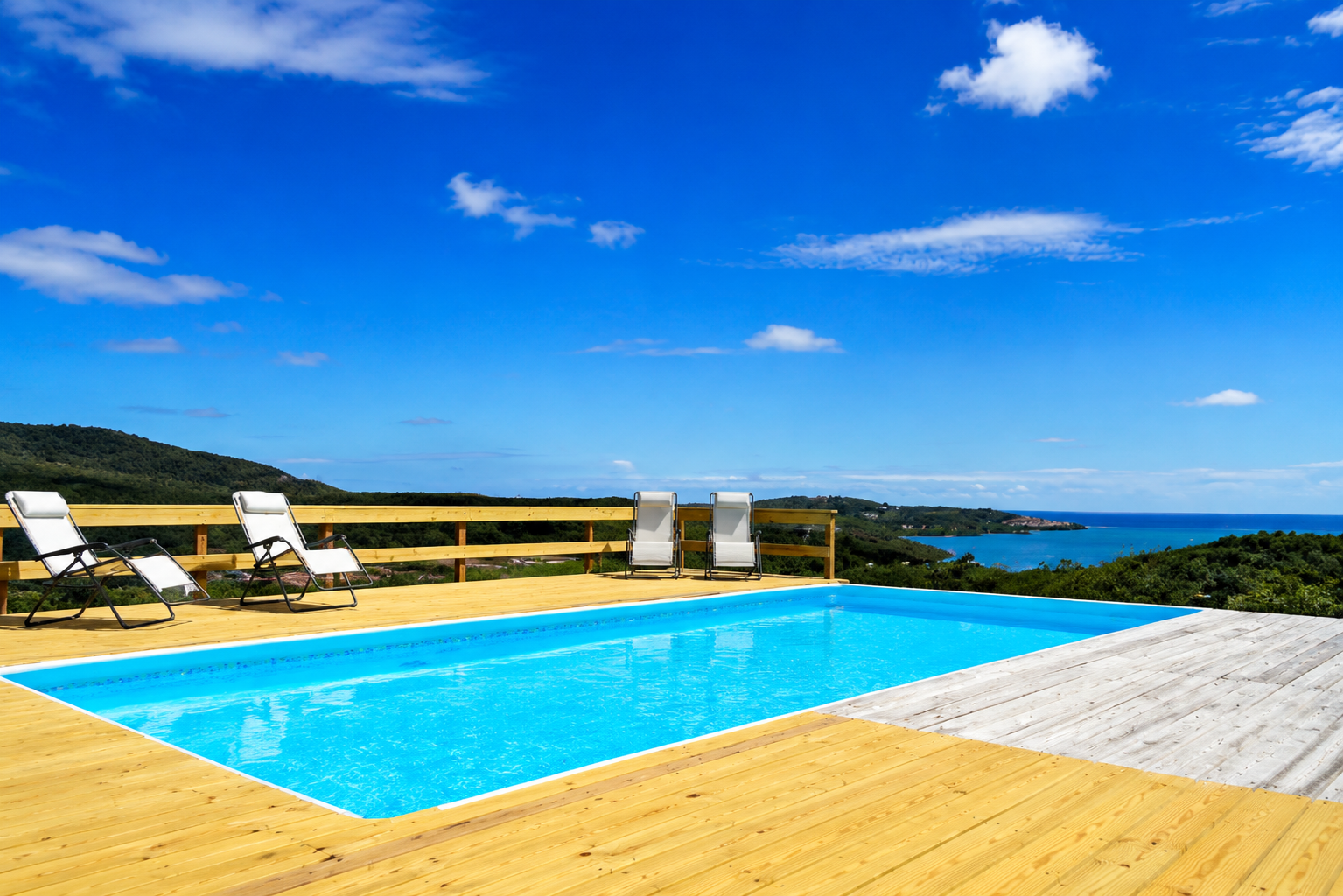 Casa Carmen's swimming pool and wooden deck above the Culebra coastline