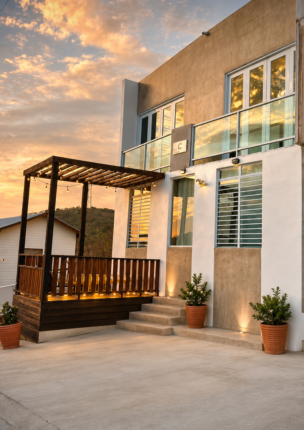 Casa Carmen entrance glowing warmly at sunset